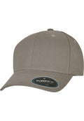 The YP217 by Flexfit By Yupoong is a plain gray baseball cap featuring a curved brim and a small sticker on the front, displayed against a white background.