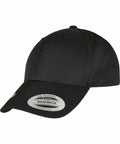 A black snapback cap with a curved brim and a sticker on the front displaying the Flexfit By Yupoong brand and "YP244.