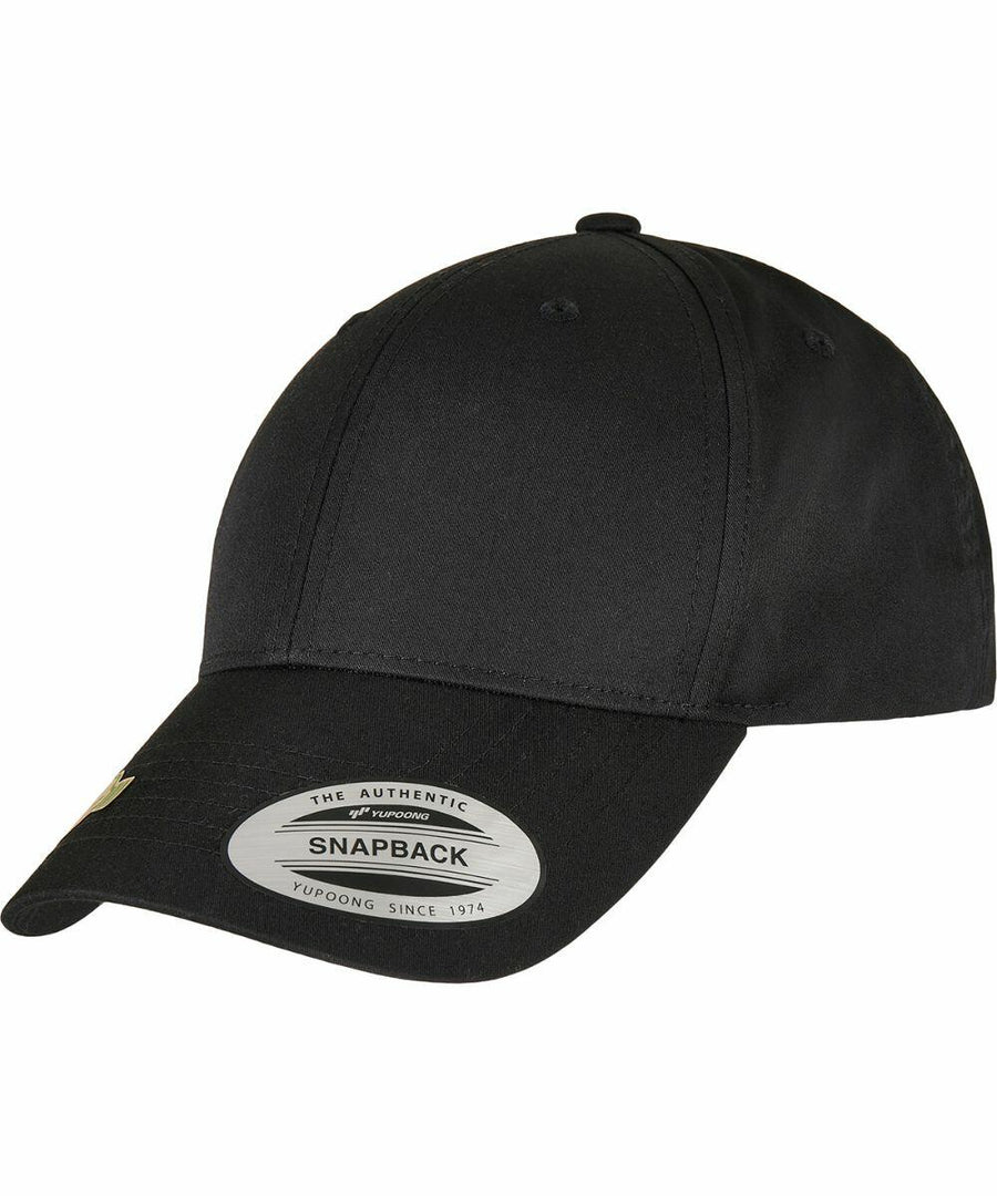 A black snapback cap with a curved brim and a sticker on the front displaying the Flexfit By Yupoong brand and "YP244.