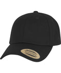 The Flexfit low-profile cap (9302) by Yupoong features a plain black design, curved brim, elastic snip, and a "The Authentic Adjustable Yupoong Since 1974" sticker on the brim. Shown against a white background.