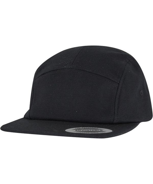 The Flexfit by Yupoong Jockey canvas cap (9297) is a black five-panel cap with a flat peak and an "Adjustable" sticker. It features a plain design with no visible logos or decorations.
