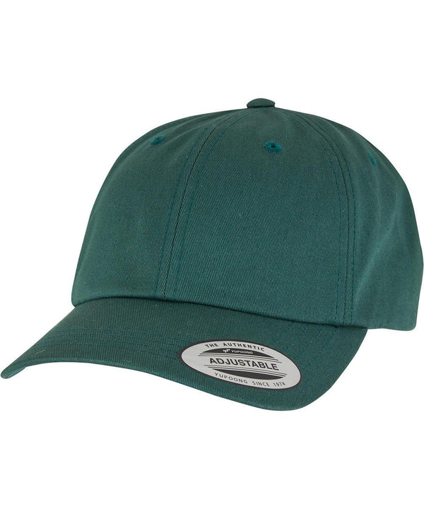 A teal green Flexfit by Yupoong low-profile cotton twill (6245CM) baseball cap with a curved peak, adjustable strap, and a peak sticker reading "The Authentic Adjustable Yupoong Since 1974.